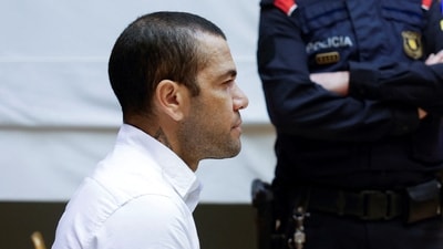 Brazil footballer Dani Alves sits in court during the first day of his trial in Barcelona, Spain (via REUTERS)