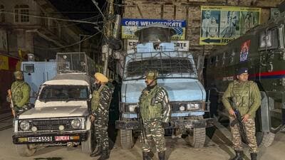 Security personnel stand guard during a cordon and search operation after terrorists shot dead a worker from Punjab while another sustained injuries in the Habba Kadal area, in Srinagar (PTI) Security personnel stand guard during a cordon and search operation after terrorists shot dead a worker from Punjab while another sustained injuries in the Habba Kadal area, in Srinagar (PTI)
