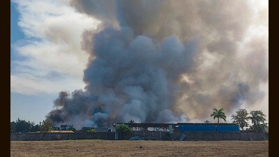 Smoke rises after blast and fire at a firecracker factory, in Harda. (PTI) Smoke rises after blast and fire at a firecracker factory, in Harda. (PTI)