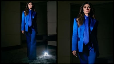 Her outfit is from the shelves of the brand Joanna Andraos and features a long sleeve blazer with a lapel collar, front flap pockets and one buttons fastening at the front. She teamed it with a matching tie and high-waist flared trousers with a front zip fly adding chic vibes. (Instagram/@theshilpashetty) Her outfit is from the shelves of the brand Joanna Andraos and features a long sleeve blazer with a lapel collar, front flap pockets and one buttons fastening at the front. She teamed it with a matching tie and high-waist flared trousers with a front zip fly adding chic vibes. (Instagram/@theshilpashetty)