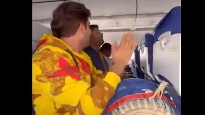 Snapshot of the passenger playing dholak in an IndiGo flight. (X/@CBhoomia) Snapshot of the passenger playing dholak in an IndiGo flight. (X/@CBhoomia)