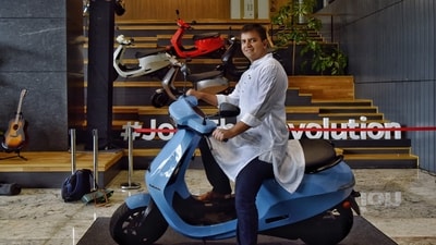 Bhavish Aggarwal, co-founder and CEO of Ola, poses for a photograph with the new Ola electric scooter during its launch at the Ola headquarters in Bangalore on August 15, 2021. (AFP) Bhavish Aggarwal, co-founder and CEO of Ola, poses for a photograph with the new Ola electric scooter during its launch at the Ola headquarters in Bangalore on August 15, 2021. (AFP)