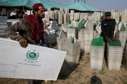 A member of polling staff leaves after collecting polling material for Feb. 8 general elections at a distribution center in Peshawar on February 7. (AP) A member of polling staff leaves after collecting polling material for Feb. 8 general elections at a distribution center in Peshawar on February 7. (AP)