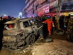 Civil defense members gather at the site of a burned vehicle targeted by a U.S. drone strike in east Baghdad, Iraq. (AP) Civil defense members gather at the site of a burned vehicle targeted by a U.S. drone strike in east Baghdad, Iraq. (AP)