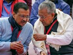 Delhi Chief Minister Arvind Kejriwal interacts with Kerala Chief Minister Pinarayi Vijayan during LDF's protest against the BJP-led Centre over alleged neglect and partiality in allocation of funds to their states, at Jantar Mantar, in New Delhi, Delhi Chief Minister Arvind Kejriwal interacts with Kerala Chief Minister Pinarayi Vijayan during LDF's protest against the BJP-led Centre over alleged neglect and partiality in allocation of funds to their states, at Jantar Mantar, in New Delhi,