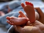 The baby was left near an under-construction jail on the Indore-Ujjain road. The baby was left near an under-construction jail on the Indore-Ujjain road.