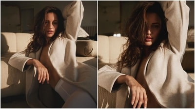 Tripti's look is all about effortless chic as she exudes cosy and comfy vibes in a long beige coat that features full sleeves and a double collar. She paired it with a pair of white high-waisted stockings and wore nothing inside. (Instagram/@tripti_dimri) Tripti's look is all about effortless chic as she exudes cosy and comfy vibes in a long beige coat that features full sleeves and a double collar. She paired it with a pair of white high-waisted stockings and wore nothing inside. (Instagram/@tripti_dimri)