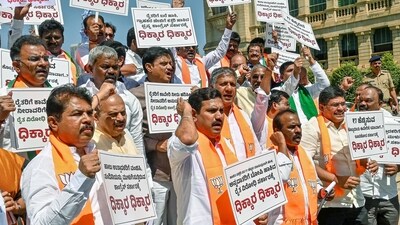 Karnataka BJP President B Y Vijayendra, Leader of Opposition in the State Assembly R Ashok, former state CM Basavaraj Bommai and other leaders protest against the state government, in Bengaluru on Wednesday. (ANI Photo) (Savitha) Karnataka BJP President B Y Vijayendra, Leader of Opposition in the State Assembly R Ashok, former state CM Basavaraj Bommai and other leaders protest against the state government, in Bengaluru on Wednesday. (ANI Photo) (Savitha)
