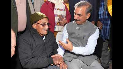 Chief minister Sukhvinder Singh Sukhu interacting with an elderly person during his visit to Jawalamukhi in Kangra on Thursday. (HT photo)