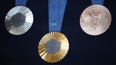 The Chaumet-designed Paris 2024 Olympic gold, silver and bronze medals, featuring a hexagon-shaped piece of iron taken from the original Eiffel Tower, (Bloomberg) The Chaumet-designed Paris 2024 Olympic gold, silver and bronze medals, featuring a hexagon-shaped piece of iron taken from the original Eiffel Tower, (Bloomberg)