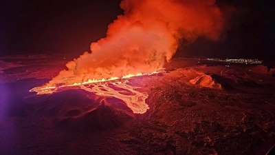 Live video from the area showed fountains of bright-orange molten rock erupting from fissures in the ground, creating a striking contrast against the dark night sky.&nbsp; (via REUTERS)