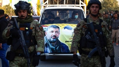 A portrait of Abu Baqir al-Saadi, a prominent leader in the Phalange, who was killed in a strike carried out a day earlier by an American drone that targeted his car in a vital neighbourhood in Baghdad, is plastered on a car during his funeral in Baghdad on February 8, 2024 (AFP) A portrait of Abu Baqir al-Saadi, a prominent leader in the Phalange, who was killed in a strike carried out a day earlier by an American drone that targeted his car in a vital neighbourhood in Baghdad, is plastered on a car during his funeral in Baghdad on February 8, 2024 (AFP)