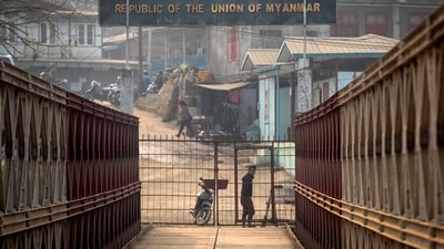 A Myanmarese looks towards the Indian side at the India-Myanmar border in Mizoram. (AP) A Myanmarese looks towards the Indian side at the India-Myanmar border in Mizoram. (AP)