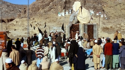 People hold black flags as they boycott voting during the general election as part of a protest against authorities for not fulfilling their demands, at Landi Kotal in Khyber Pakhtunkhwa province, Pakistan (REUTERS)