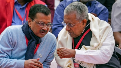 Delhi Chief Minister Arvind Kejriwal interacts with Kerala Chief Minister Pinarayi Vijayan during LDF's protest against the BJP-led Centre over alleged neglect and partiality in allocation of funds to their states, at Jantar Mantar, in New Delhi, (PTI)