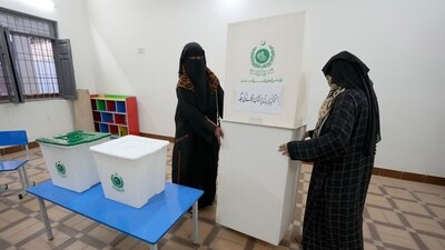 Members of the polling staff set up a polling station for the Feb. 8 parliamentary elections, in Karachi, Pakistan. (AP) Members of the polling staff set up a polling station for the Feb. 8 parliamentary elections, in Karachi, Pakistan. (AP)