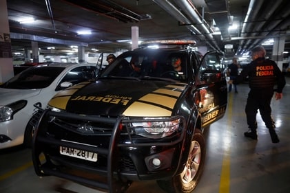 Federal police officers leave the headquarters of the Liberal Party during an operation targeting some of former President Jair Bolsonaro's top aides in Brasilia, Brazil on February 8. (Reuters)