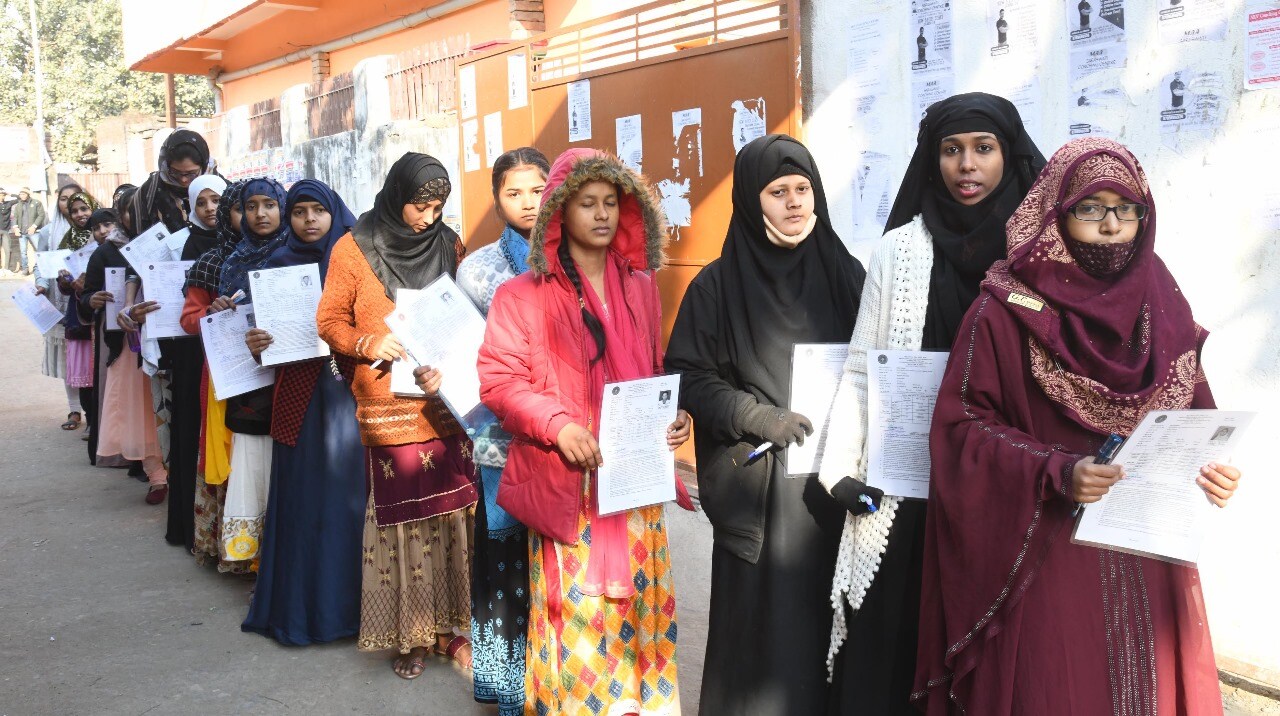Students standing in queue to appear in the Bihar Board Class 12th examination at D.D. Nandan Kanya High School Danapur in Patna 
(Photo by Santosh Kumar)