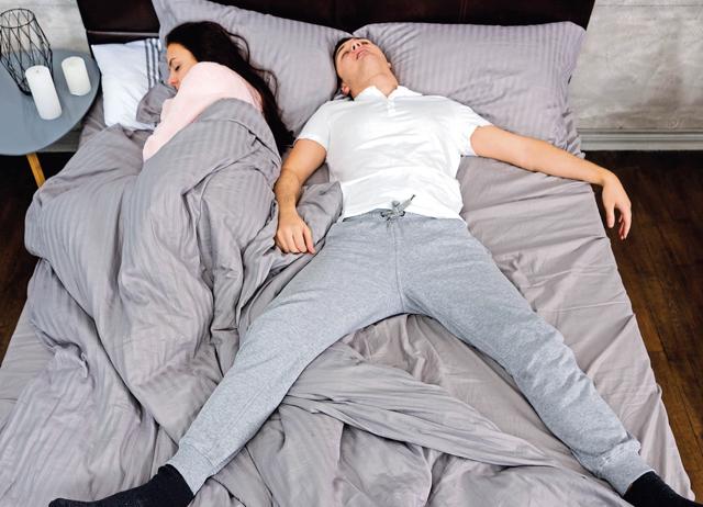 Dating someone who takes over your bed is a beige flag. It’ll may just lead to a cute bed war. (Shutterstock) Dating someone who takes over your bed is a beige flag. It’ll may just lead to a cute bed war. (Shutterstock)