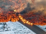 Iceland Volcano: Lava crosses the main road to Grindavík and flows on the road leading to the Blue Lagoon, in Grindavík, Iceland. Iceland Volcano: Lava crosses the main road to Grindavík and flows on the road leading to the Blue Lagoon, in Grindavík, Iceland.