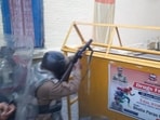 Security personnel at the site after a group of protestors hurled stones and set vehicles on fire, over the demolition of an "illegally built" madrasa at Banbhoolpura area, in Haldwani.