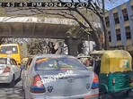 The image shows an auto-rickshaw that rammed into a car's door. The image shows an auto-rickshaw that rammed into a car's door.