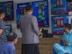 People monitor live election results on a screen in an electronic shop at a local market in Karachi, Pakistan, on Friday, Feb. 9, 2024. Vote-counting delays following Pakistan�s election on Thursday pointed to a disputed result as supporters of jailed former leader Imran Khan claimed a shock victory in a nation where the military retains a heavy influence on politics. Photographer: Asim Hafeez/Bloomberg People monitor live election results on a screen in an electronic shop at a local market in Karachi, Pakistan, on Friday, Feb. 9, 2024. Vote-counting delays following Pakistan�s election on Thursday pointed to a disputed result as supporters of jailed former leader Imran Khan claimed a shock victory in a nation where the military retains a heavy influence on politics. Photographer: Asim Hafeez/Bloomberg