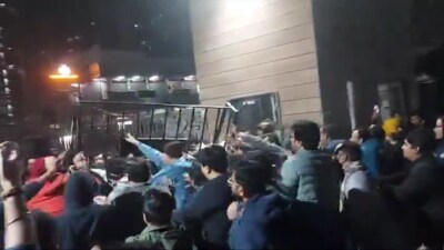 A CCTV grab of the commotion outside the gates of White Orchid apartments in Gaur City-2 township in Greater Noida West, on Thursday night. (HT Photo) A CCTV grab of the commotion outside the gates of White Orchid apartments in Gaur City-2 township in Greater Noida West, on Thursday night. (HT Photo)