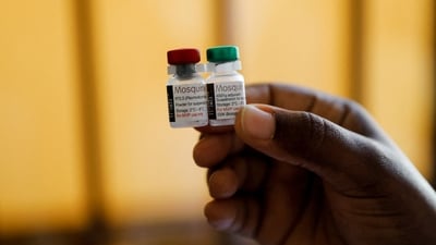 A nurse holds malaria vaccine vials before administering it to an infant at the Lumumba Sub-County hospital in Kisumu, Kenya. (Reuters)