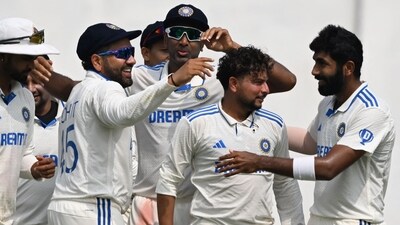 India's captain Rohit Sharma (L) and India's Jasprit Bumrah (R) congratulate Kuldeep Yadav (2nd R) after he took the wicket of England's Zak Crawley during the fourth day of the second Test (AFP) India's captain Rohit Sharma (L) and India's Jasprit Bumrah (R) congratulate Kuldeep Yadav (2nd R) after he took the wicket of England's Zak Crawley during the fourth day of the second Test (AFP)