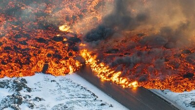 Iceland Volcano: Lava crosses the main road to Grindavík and flows on the road leading to the Blue Lagoon, in Grindavík, Iceland. (AP)