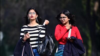 Girls enjoying the sunny day at Panjab University Campus in Chandigarh on Friday. (Ravi Kumar/HT)