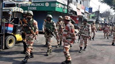Police officers patrol a road a day after clashes during a government demolition drive, in Haldwani. (Reuters)