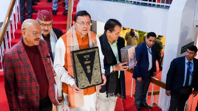 Uttarakhand Chief Minister Pushkar Singh Dhami with others holds a copy of the Constitution of India, at Vidhan Sabha Bhawan, in Dehradun. (PTI) Uttarakhand Chief Minister Pushkar Singh Dhami with others holds a copy of the Constitution of India, at Vidhan Sabha Bhawan, in Dehradun. (PTI)