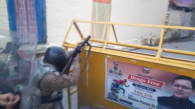 Security personnel at the site after a group of protestors hurled stones and set vehicles on fire, over the demolition of an "illegally built" madrasa at Banbhoolpura area, in Haldwani. (PTI) Security personnel at the site after a group of protestors hurled stones and set vehicles on fire, over the demolition of an "illegally built" madrasa at Banbhoolpura area, in Haldwani. (PTI)