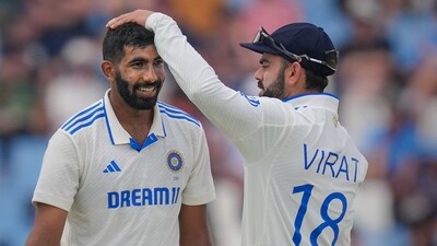 India's Jasprit Bumrah celebrates with teammate Virat Kohli (PTI)