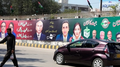 Pakistan Elections 2024: Campaign posters from political parties are displayed on a street in Karachi, Pakistan. (AP)