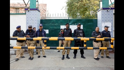 Police officers stand guard the entrance of the provincial election commission of Pakistan. (REUTERS) Police officers stand guard the entrance of the provincial election commission of Pakistan. (REUTERS)