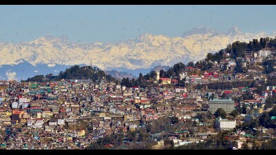Snow-covered Himalayas mountain range, seen from Shimla on Friday. (PTI)