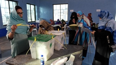 Polling staff opens the ballot boxes in presence of poling agents in Pakistan. (AFP) Polling staff opens the ballot boxes in presence of poling agents in Pakistan. (AFP)