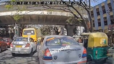 The image shows an auto-rickshaw that rammed into a car's door. (X/@3rdEyeDude) The image shows an auto-rickshaw that rammed into a car's door. (X/@3rdEyeDude)