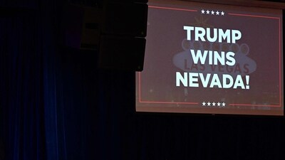 A screen announcing "Trump Wins Nevada!" is seen during a Caucus Night watch party in Las Vegas, Nevada, on February 8, 2024. (Photo by Patrick T. Fallon / AFP) (AFP)