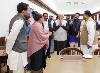 PM Modi with lawmakers in Parliament canteen.