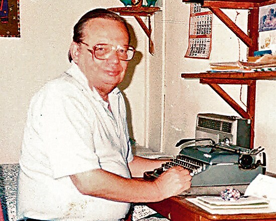 Ruskin Bond at his desk in Mussoorie. Mehra writes of a time when he visited him every month, and once made him an omelette, knowing his fondness for eggs. (Courtesy Never Out Of Print) Ruskin Bond at his desk in Mussoorie. Mehra writes of a time when he visited him every month, and once made him an omelette, knowing his fondness for eggs. (Courtesy Never Out Of Print)