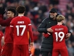 Liverpool manager Juergen Klopp celebrates with Harvey Elliott after the match