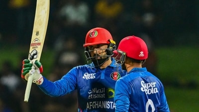Afghanistan's Mohammad Nabi celebrates with partner Azmatullah Omarzai (AFP) Afghanistan's Mohammad Nabi celebrates with partner Azmatullah Omarzai (AFP)