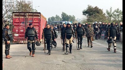 Paramilitary personnel stay vigil after security tightened ahead of the farmers' march to Delhi, which is scheduled to be held on February 13, in Ambala on Saturday. (ANI)