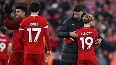 Liverpool manager Juergen Klopp celebrates with Harvey Elliott after the match (REUTERS)