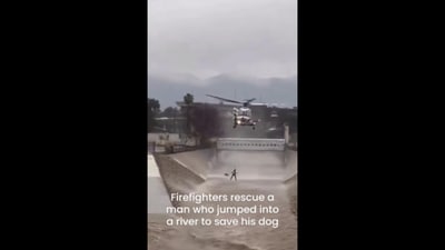 The image shows a man being rescued who got trapped while trying to save his dog. (Instagram/@goodnews_movement) The image shows a man being rescued who got trapped while trying to save his dog. (Instagram/@goodnews_movement)