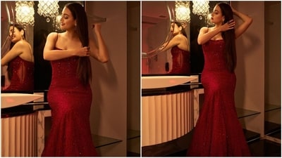 Dia's glamorous gown comes in a captivating shade of red and features luxurious tulle fabric with barely-there straps, a plunging neckline, a figure-hugging fit, a flared maxi hem and stunning sequin embellishment that added a dramatic finish to her outfit. (Instagram/@diamirzaofficial)